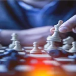 Meta-Deck Construction: Applying Game Theory & Opponent Modeling to Win Competitive Card Games